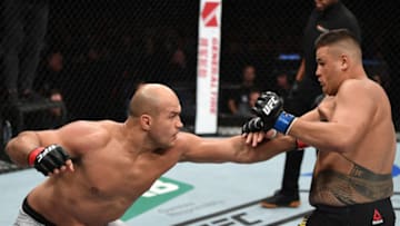 ADELAIDE, AUSTRALIA - DECEMBER 02: (L-R) Junior Dos Santos of Brazil punches Tai Tuivasa of Australia in their heavyweight bout during the UFC Fight Night event inside Adelaide Entertainment Centre on December 2, 2018 in Adelaide, Australia. (Photo by Jeff Bottari/Zuffa LLC/Zuffa LLC via Getty Images)