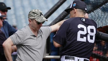 Mar 2, 2016; Tampa, FL, USA; New York Yankees general manager Brian Cashman talks with manager Joe Girardi (28) prior to the game at George M. Steinbrenner Field. Mandatory Credit: Kim Klement-USA TODAY Sports
