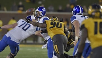 Nov 1, 2014; Columbia, MO, USA; Kentucky Wildcats quarterback Patrick Towles (14) is sacked by Missouri Tigers defensive lineman Markus Golden (33) and defensive lineman Harold Brantley (90) during the second half at Faurot Field. Missouri won 20-10. Mandatory Credit: Denny Medley-USA TODAY Sports