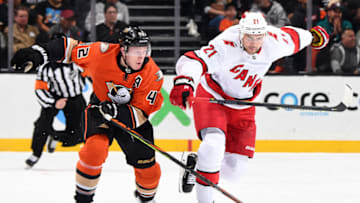 ANAHEIM, CA - OCTOBER 18: Nino Niederreiter #21 of the Carolina Hurricanes skates against Josh Manson #42 of the Anaheim Ducks during the game at Honda Center on October 18, 2019 in Anaheim, California. (Photo by Robert Binder/NHLI via Getty Images)