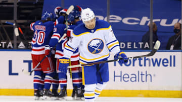 NEW YORK, NEW YORK - APRIL 27: Rasmus Asplund #74 of the Buffalo Sabres skates back to the bench following a third period insurance goal by Mika Zibanejad #93 at Madison Square Garden on April 27, 2021 in New York City. The Rangers defeated the Sabres 3-1. (Photo by Bruce Bennett/Getty Images)