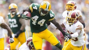 Sep 15, 2013; Green Bay, WI, USA; Green Bay Packers running back James Starks (44) rushes with the football as Washington Redskins cornerback David Amerson (39) defends during the third quarter at Lambeau Field. Green Bay won 38-20. Mandatory Credit: Jeff Hanisch-USA TODAY Sports