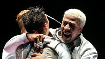RIO DE JANEIRO, BRAZIL - AUGUST 12, 2016: Alexander Massialas (L) and Miles Chamley-Watson of the USA celebrate their team's victory in the Men's Foil Team Bronze Medal Match during the fencing event at the 2016 Summer Olympic Games in Rio de Janeiro, Brazil, at Carioca Arena 3. Valery Sharifulin/TASS (Photo by Valery Sharifulin\TASS via Getty Images)