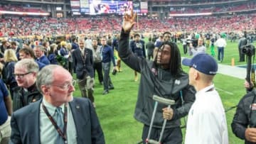Jan 1, 2016; Glendale, AZ, USA; Notre Dame Fighting Irish linebacker Jaylon Smith (9) waves as he leaves the field following the 2016 Fiesta Bowl at University of Phoenix Stadium. Smith was injured in the first quarter and left the game. The Ohio State Buckeyes defeated Notre Dame 44-28. Mandatory Credit: Matt Cashore-USA TODAY Sports