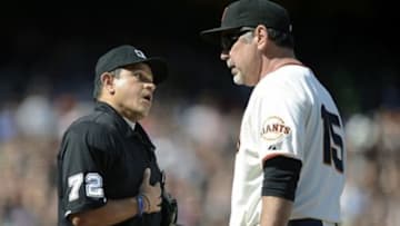May 25, 2013; San Francisco, CA, USA; San Francisco Giants manager Bruce Bochy (15) is ejected from the game by home plate umpire Alfonso Marquez (72) in the bottom of the eight inning against the Colorado Rockies at AT