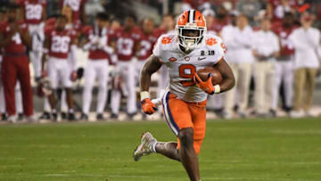 SANTA CLARA, CA - JANUARY 07: Travis Etienne #9 of the Clemson Tigers carries the ball against the Alabama Crimson Tide in the CFP National Championship presented by AT&T at Levi's Stadium on January 7, 2019 in Santa Clara, California. (Photo by Harry How/Getty Images)