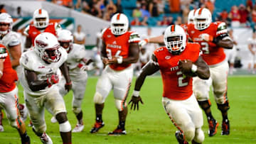 Sep 10, 2016; Miami Gardens, FL, USA; Miami Hurricanes running back Joseph Yearby (2) carries the ball past Florida Atlantic Owls during the second half at Hard Rock Stadium. Miami won 38-10. Mandatory Credit: Steve Mitchell-USA TODAY Sports