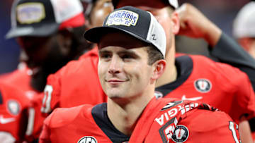 ATLANTA, GEORGIA - DECEMBER 03: Stetson Bennett #13 of the Georgia Bulldogs celebrates after defeating the LSU Tigers in the SEC Championship game at Mercedes-Benz Stadium on December 03, 2022 in Atlanta, Georgia. (Photo by Kevin C. Cox/Getty Images)