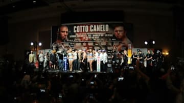 Nov 20, 2015; Las Vegas, NV, USA; Miguel Cotto and Canelo Alvarez during weigh ins for their upcoming middleweight championship fight at Mandalay Bay. Mandatory Credit: Joe Camporeale-USA TODAY Sports