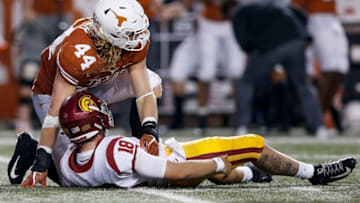AUSTIN, TX - SEPTEMBER 15: Breckyn Hager #44 of the Texas Longhorns hits JT Daniels #18 of the USC Trojans in the second half at Darrell K Royal-Texas Memorial Stadium on September 15, 2018 in Austin, Texas. (Photo by Tim Warner/Getty Images)