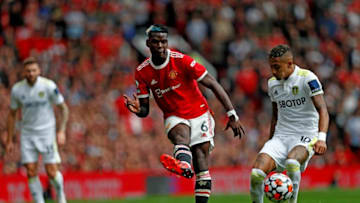 Manchester United's French midfielder Paul Pogba controls the ball during the English Premier League football match between Manchester United and Leeds United at Old Trafford in Manchester, north west England, on August 14, 2021. - RESTRICTED TO EDITORIAL USE. No use with unauthorized audio, video, data, fixture lists, club/league logos or 'live' services. Online in-match use limited to 120 images. An additional 40 images may be used in extra time. No video emulation. Social media in-match use limited to 120 images. An additional 40 images may be used in extra time. No use in betting publications, games or single club/league/player publications. (Photo by Adrian DENNIS / AFP) / RESTRICTED TO EDITORIAL USE. No use with unauthorized audio, video, data, fixture lists, club/league logos or 'live' services. Online in-match use limited to 120 images. An additional 40 images may be used in extra time. No video emulation. Social media in-match use limited to 120 images. An additional 40 images may be used in extra time. No use in betting publications, games or single club/league/player publications. / RESTRICTED TO EDITORIAL USE. No use with unauthorized audio, video, data, fixture lists, club/league logos or 'live' services. Online in-match use limited to 120 images. An additional 40 images may be used in extra time. No video emulation. Social media in-match use limited to 120 images. An additional 40 images may be used in extra time. No use in betting publications, games or single club/league/player publications. (Photo by ADRIAN DENNIS/AFP via Getty Images)