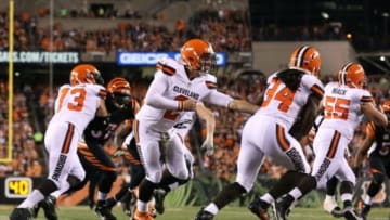 Nov 5, 2015; Cincinnati, OH, USA; Cleveland Browns quarterback Johnny Manziel (2) hands the ball off to running back Isaiah Crowell (34) in the second half against the Cincinnati Bengals at Paul Brown Stadium. Mandatory Credit: Aaron Doster-USA TODAY Sports