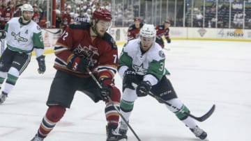 TUCSON, AZ - MAY 02: Tucson Roadrunners center Ryan MacInnis (72) and Texas Stars defenseman Dillon Heatherington (3) fight for the puck during a hockey game between the Texas Stars and Tuscon Roadrunners on May 02, 2018, at Tucson Convention Center in Tucson, AZ. (Photo by Jacob Snow/Icon Sportswire via Getty Images)