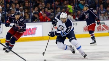Nov 25, 2014; Columbus, OH, USA; Winnipeg Jets left wing Evander Kane (9) controls the puck against the Columbus Blue Jackets during the third period at Nationwide Arena. Winnipeg beat Columbus 4-2. Mandatory Credit: Russell LaBounty-USA TODAY Sports
