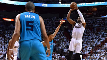 Apr 20, 2016; Miami, FL, USA; Miami Heat guard Dwyane Wade (3) and Charlotte Hornets guard Courtney Lee (1) battle for the ball in game two of the first round of the NBA Playoffs during the fourth quarter at American Airlines Arena. The Heat won 115-103. Mandatory Credit: Steve Mitchell-USA TODAY Sports