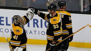 BOSTON - NOVEMBER 11: Boston Bruins goalie Jaroslav Halak, left, is congratulated by teammate Zdeno Chara at the end of the third period. The Bruins won 4-1. The Boston Bruins host the Vegas Golden Knights in a regular season NHL hockey game at TD Garden in Boston on Nov. 11, 2018. (Photo by Jessica Rinaldi/The Boston Globe via Getty Images)