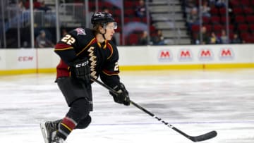 CLEVELAND, OH - JANUARY 24: Cleveland Monsters left wing Sonny Milano (22) controls the puck man Zach Whitecloud (32) defends during the second period of the American Hockey League game between the Chicago Wolves and Cleveland Monsters on January 24, 2019, at Quicken Loans Arena in Cleveland, OH. (Photo by Frank Jansky/Icon Sportswire via Getty Images)