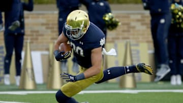 SOUTH BEND, IN - OCTOBER 28: Durham Smythe #80 of the Notre Dame Fighting Irish scores a touchdown in the first quarter against the North Carolina State Wolfpack at Notre Dame Stadium on October 28, 2017 in South Bend, Indiana. (Photo by Dylan Buell/Getty Images)