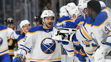 Jan 1, 2022; Boston, Massachusetts, USA; Buffalo Sabres center Vinnie Hinostroza (29) celebrates with his teammates after scoring a goal against the Boston Bruins during the first period at TD Garden. Mandatory Credit: Brian Fluharty-USA TODAY Sports