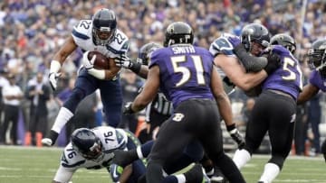 Dec 13, 2015; Baltimore, MD, USA; Seattle Seahawks running back Fred Jackson (22) leaps over tackle Russell Okung (76) during the first quarter against the Baltimore Ravens at M&T Bank Stadium. Mandatory Credit: Tommy Gilligan-USA TODAY Sports