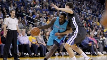 Nov 15, 2014; Oakland, CA, USA; Charlotte Hornets guard Lance Stephenson (1) attempts to drive past Golden State Warriors guard Klay Thompson (11) in the first quarter at Oracle Arena. Mandatory Credit: Cary Edmondson-USA TODAY Sports