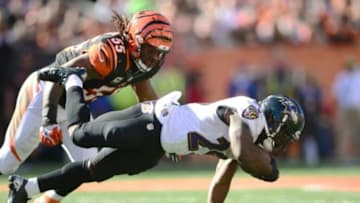 Oct 26, 2014; Cincinnati, OH, USA; Cincinnati Bengals outside linebacker Vontaze Burfict (55) tackles Baltimore Ravens running back Justin Forsett (29) during the third quarter at Paul Brown Stadium. Mandatory Credit: Andrew Weber-USA TODAY Sports