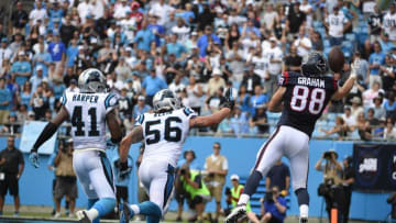 Sep 20, 2015; Charlotte, NC, USA; Houston Texans tight end Garrett Graham (88) catches a touchdown as Carolina Panthers strong safety Roman Harper (41) and outside linebacker A.J. Klein (56) defend in the third quarter. The Panthers defeated the Texans 24-17 at Bank of America Stadium. Mandatory Credit: Bob Donnan-USA TODAY Sports