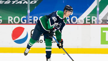 VANCOUVER, BC - FEBRUARY 19: Elias Pettersson #40 of the Vancouver Canucks shoots the puck during the pre-game warmup prior to NHL hockey action against the Winnipeg Jets at Rogers Arena on February 19, 2021 in Vancouver, Canada. (Photo by Rich Lam/Getty Images)