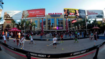 Oct 9, 2014; Glendale, AZ, USA; Young fans play street hockey prior to the game between the Arizona Coyotes and the Winnipeg Jets at Gila River Arena. Mandatory Credit: Matt Kartozian-USA TODAY Sports