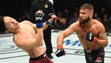 ST. LOUIS, MO - JANUARY 14: (R-L) Jeremy Stephens punches Dooho Choi of South Korea in their featherweight bout during the UFC Fight Night event inside the Scottrade Center on January 14, 2018 in St. Louis, Missouri. (Photo by Josh Hedges/Zuffa LLC/Zuffa LLC via Getty Images)