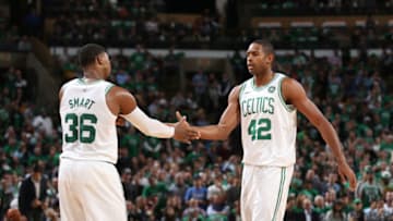 BOSTON, MA - OCTOBER 18: Marcus Smart #36 and Al Horford #42 of the Boston Celtics high five during the game against the Milwaukee Bucks on October 18, 2017 at the TD Garden in Boston, Massachusetts. NOTE TO USER: User expressly acknowledges and agrees that, by downloading and or using this photograph, User is consenting to the terms and conditions of the Getty Images License Agreement. Mandatory Copyright Notice: Copyright 2017 NBAE (Photo by Chris Marion/NBAE via Getty Images)