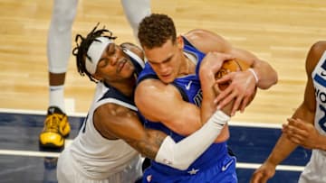 Minnesota Timberwolves forward Jarred Vanderbilt fights Dallas Mavericks' center Dwight Powell for a rebound. Mandatory Credit: Bruce Kluckhohn-USA TODAY Sports