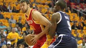 Jan 15, 2015; Houston, TX, USA; Houston Rockets forward Donatas Motiejunas (20) holds the ball as Oklahoma City Thunder forward Serge Ibaka (9) defends in the first quarter at Toyota Center. Mandatory Credit: Thomas B. Shea-USA TODAY Sports