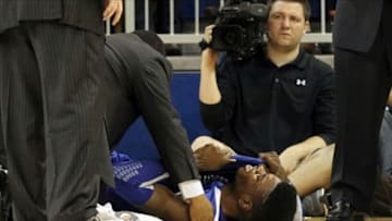 February 12, 2013; Gainesville, FL, USA; Kentucky Wildcats forward Nerlens Noel (3) reacts on the ground after hurting his knee against the Florida Gators during the second half at the Stephen C. O