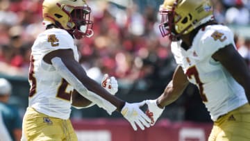 PHILADELPHIA, PA - SEPTEMBER 18: Travis Levy #23 celebrates with teammate Kobay White #7 after scoring a touchdown against the Temple Owls at Lincoln Financial Field on September 18, 2021 in Philadelphia, Pennsylvania. (Photo by Cody Glenn/Getty Images)