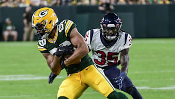 Aug 14, 2021; Green Bay, Wisconsin, USA; Green Bay Packers wide receiver Malik Taylor (86) catches a pass in the third quarter against Houston Texans cornerback Keion Crossen (35) at Lambeau Field. Mandatory Credit: Benny Sieu-USA TODAY Sports