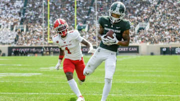Michigan State's Jalen Nailor, right, catches a touchdown pass as Youngstown State's Zaire Jones defends during the third quarter on Saturday, Sept. 11, 2021, at Spartan Stadium in East Lansing.210911 Msu Youngstown Fb 247a