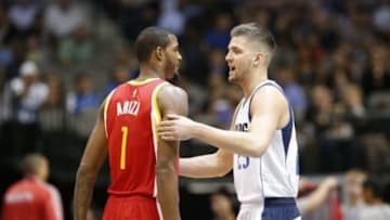 Oct 7, 2014; Dallas, TX, USA; Dallas Mavericks forward Chandler Parsons (25) hugs Houston Rockets forward Trevor Ariza (1) prior to the game at American Airlines Center. Mandatory Credit: Matthew Emmons-USA TODAY Sports