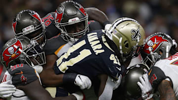 NEW ORLEANS, LA - SEPTEMBER 09: Alvin Kamara #41 of the New Orleans Saints is tackled by the Tampa Bay Buccaneers defense during the second half at the Mercedes-Benz Superdome on September 9, 2018 in New Orleans, Louisiana. (Photo by Jonathan Bachman/Getty Images)