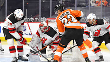 Mar 23, 2021; Philadelphia, Pennsylvania, USA; New Jersey Devils goaltender Mackenzie Blackwood (29) makes a save as defenseman P.K. Subban (76) and defenseman Dmitry Kulikov (70) defend against Philadelphia Flyers left wing Oskar Lindblom (23) during the third period at Wells Fargo Center. Mandatory Credit: Eric Hartline-USA TODAY Sports