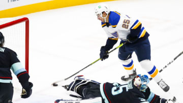 Jan 21, 2022; Seattle, Washington, USA; St. Louis Blues center Jordan Kyrou (25) scores a goal against Seattle Kraken goaltender Joey Daccord (35) during the third period at Climate Pledge Arena. Mandatory Credit: Joe Nicholson-USA TODAY Sports