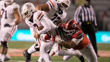 SALT LAKE CITY UT- NOVEMBER 5: Aliki Vimahi #95 of the Utah Utes sacks Jayden de Laura #7 of the Arizona Wildcats during the second half of their game at Rice Eccles Stadium November 5, 2022 in Salt Lake City Utah. (Photo by Chris Gardner/ Getty Images)