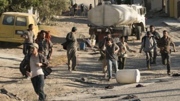 The Infected approach as people try to get water - Fear the Walking Dead _ Season 3, Episode 9 - Photo Credit: Richard Foreman, Jr/AMC