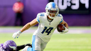 MINNEAPOLIS, MINNESOTA - OCTOBER 10: Amon-Ra St. Brown #14 of the Detroit Lions runs the ball during the second half against the Minnesota Vikings at U.S. Bank Stadium on October 10, 2021 in Minneapolis, Minnesota. (Photo by Adam Bettcher/Getty Images)