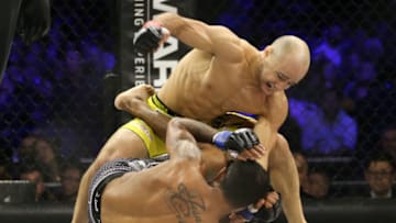 NEW YORK, NY - DECEMBER 31: Marlon Moraes (top) throws a right hand at Josenaldo Silva (bottom) during their World Series of Fighting bantamweight championship fight at The Theater at Madison Square Garden on December 31, 2016 in New York City. (Photo by Ed Mulholland/Getty Images)