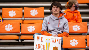 CLEMSON, SOUTH CAROLINA - OCTOBER 30: A fan holds a sign referencing high school recruit Arch Manning before the game between the Clemson Tigers and the Florida State Seminoles at Clemson Memorial Stadium on October 30, 2021 in Clemson, South Carolina. (Photo by Jacob Kupferman/Getty Images)