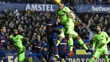 Levante's Ghanaian forward Emmanuel Boateng (4L) vies with Barcelona's Dutch defender Thomas Vermaelen during the Spanish League football match between Levante and Barcelona at the Ciutat de Valencia stadium in Valencia on December 16, 2018. (Photo by JOSE JORDAN / AFP) (Photo credit should read JOSE JORDAN/AFP/Getty Images)