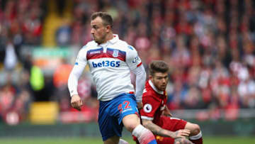 LIVERPOOL, ENGLAND - APRIL 28: Xherdan Shaqiri of Stoke City turns Alberto Moreno of Liverpool during the Premier League match between Liverpool and Stoke City at Anfield on April 28, 2018 in Liverpool, England. (Photo by Clive Brunskill/Getty Images)