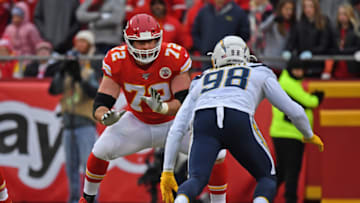 KANSAS CITY, MO - DECEMBER 29: Offensive tackle Eric Fisher #72 of the Kansas City Chiefs gets set to block defensive end Isaac Rochell #98 of the Los Angeles Chargers during the first half at Arrowhead Stadium on December 29, 2019 in Kansas City, Missouri. (Photo by Peter G. Aiken/Getty Images)
