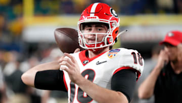 MIAMI GARDENS, FLORIDA - DECEMBER 31: JT Daniels #18 of the Georgia Bulldogs warms up before the game against the Michigan Wolverines in the Capital One Orange Bowl for the College Football Playoff semifinal game at Hard Rock Stadium on December 31, 2021 in Miami Gardens, Florida. (Photo by Mark Brown/Getty Images)